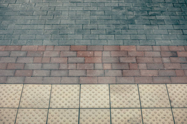 istock The texture of the paved tile. Cement brick squared stone floor background. 1251299732
