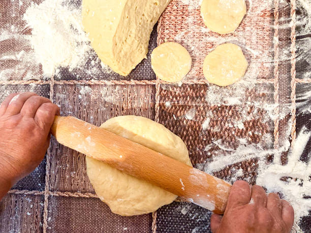 istock Raw dough on a wooden surface. 1251300466