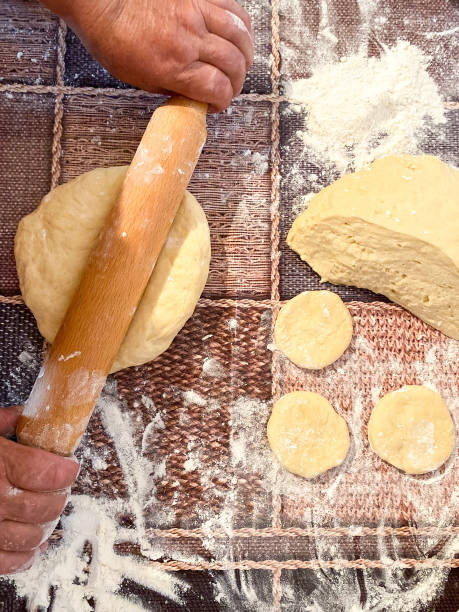 istock Raw dough on a wooden surface. 1251300492