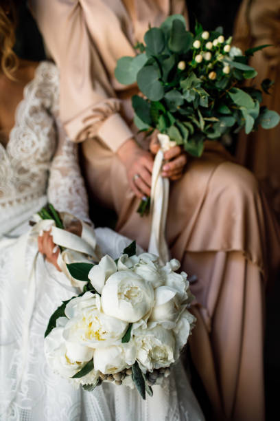 istock The bride holds a bouquet in her hands. Sit. 1251300530