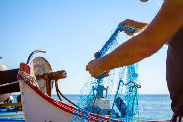 istock Fisher pile up fishing net at sandy beach 1251300564