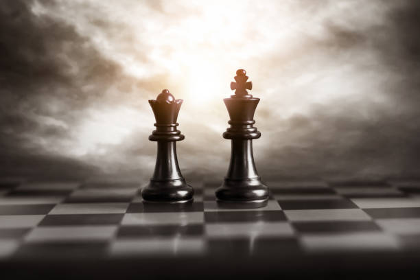 istock Black king and queen on chess board 1251300609