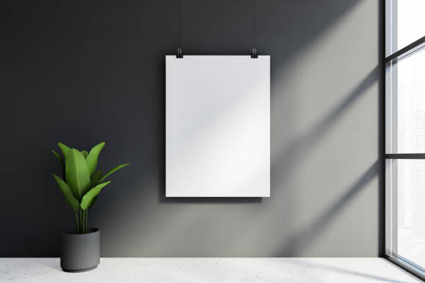 istock Mock up poster and plant in gray room 1251300983