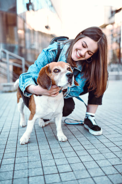 istock Smiling Female Enjoying Time With Her Dog Outside 1251301928