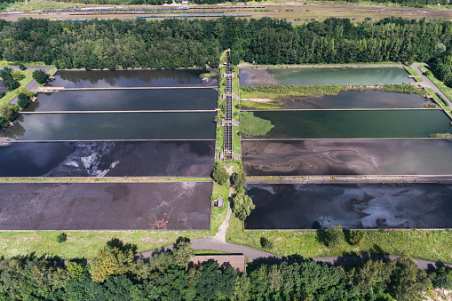 Abstract sendimentation tank of ironworks water treatment plant in Dabrowa Gornicza Silesia Poland aerial drone photo view