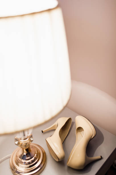 istock Bride's shoes on the table. 1251302515