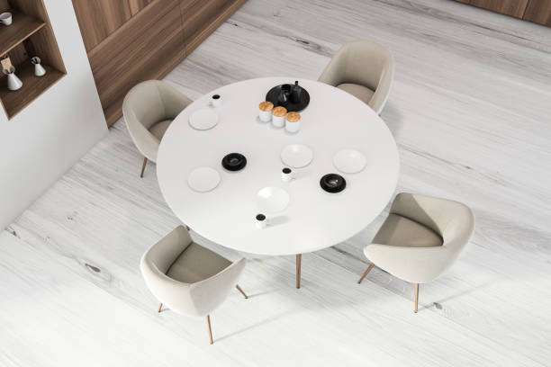 istock White and wooden dining room, top view 1251302758