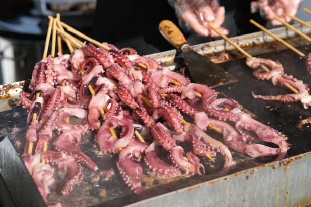 istock cooking grilled squid on grill on sunny day 1251304072