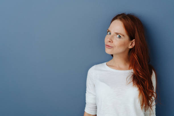 istock Astute sceptical young woman looking at camera 1251304248