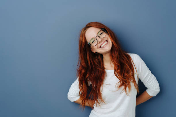 istock Happy attractive young redhead woman 1251304685