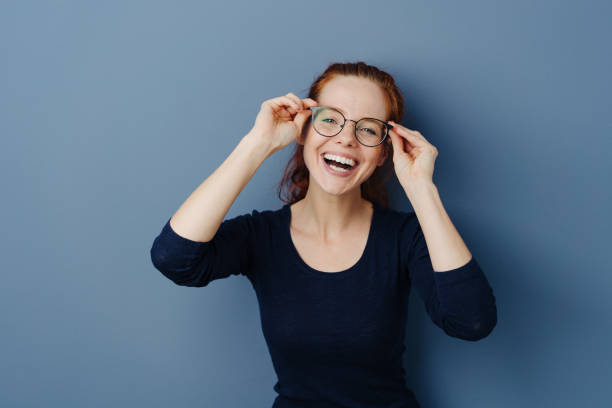 istock Cute laughing young woman wearing spectacles 1251305377