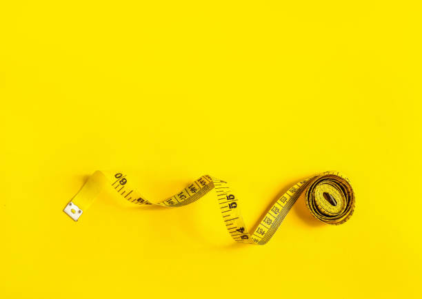istock Yellow tape measure with curl 1251305447