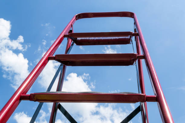istock Red stairs rest against the blue sky. 1251305594