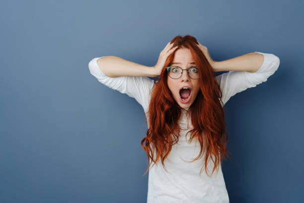 istock Aghast young woman in a panic 1251306311