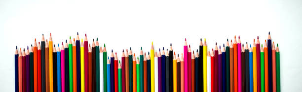 istock Row of different colored pencils. Rainbow colored pencils are jiggling side by side. School accessories, back to school concept. flat lay. 1251307675
