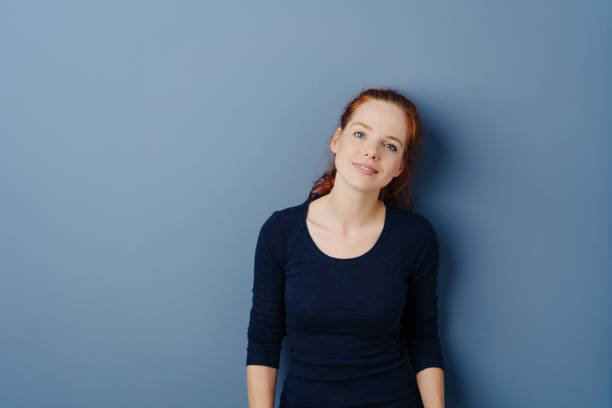 istock Serious intense young redhead woman 1251307885