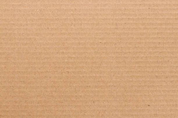 fond abstrait de feuille de carton brun, texture de boîte de papier de recyclage dans le vieux modèle de cru pour l’oeuvre d’art de conception. - brown paper paper striped corrugated cardboard photos et images de collection