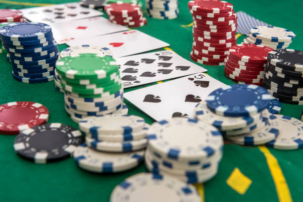 istock many poker chips with play card on casino table 1251308470