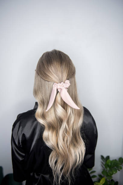 istock Beautiful highlighted curly hair, new hairstyle 1251308576