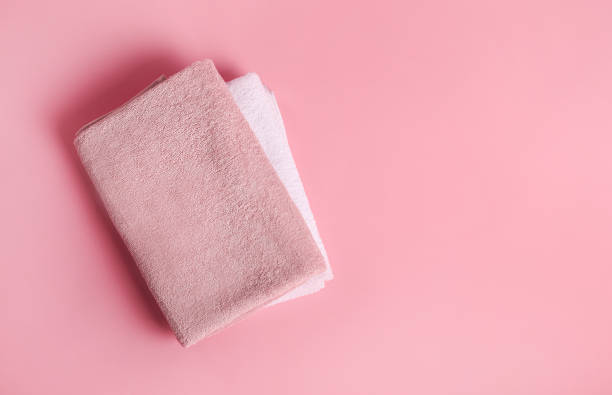 istock Bath towels on pink background 1251308695