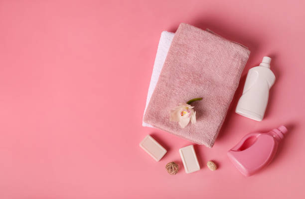 istock Bath towels and detergents on pink background 1251308736