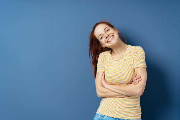 istock Cute young woman with a lovely friendly smile 1251310663