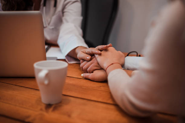 istock Close-up image of supporting hands of friendly general practitioner. 1251314100