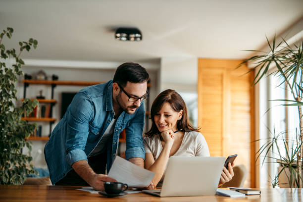 istock Couple doing finances at home, portrait. 1251314144