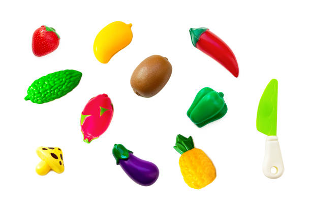 istock Toy plastic fruits and vegetable collection set isolated on white background. Plastic fruit for the game. Playing at the kids store. 1251316547