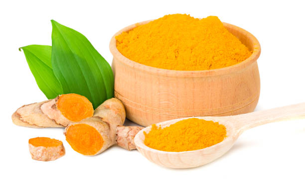 istock Turmeric powder with turmeric root isolated on white background 1251318002