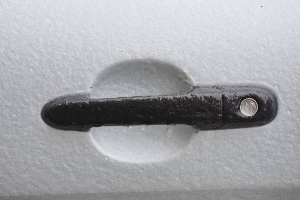 istock frozen white car door lock,Black car 1251318131