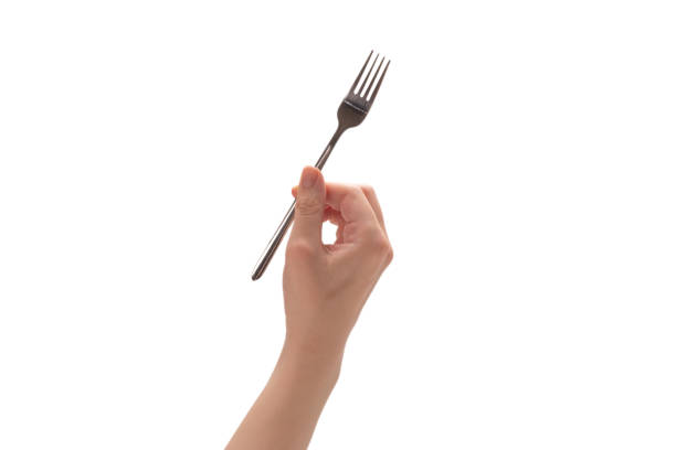 istock Fork in woman hand isolated on white. 1251319642