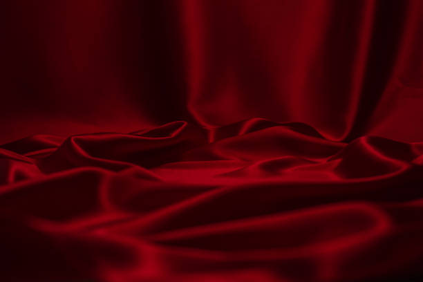 istock Red silk or satin luxury fabric texture can use as abstract background. 1251319644