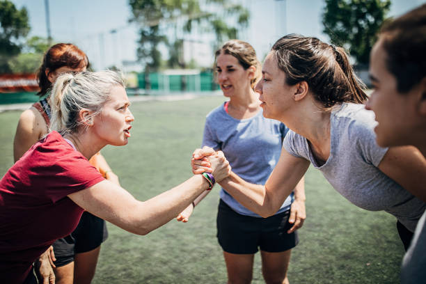 istock Women handshake on a soccer field 1251321439