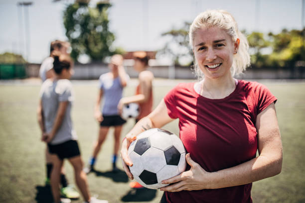 istock Woman standing outdoors on soccer field 1251321915