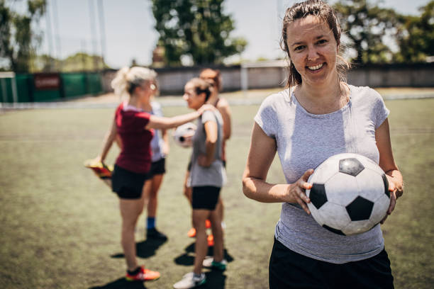 istock Woman standing on soccer field 1251321957