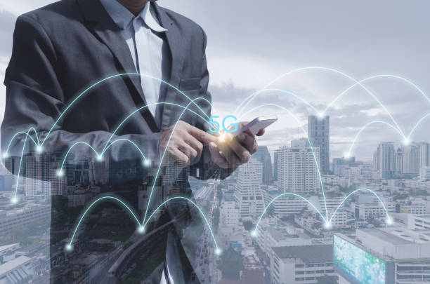 istock double exposure business man using smartphone with city background 5G wireless global internet web network connectivity technology digital wifi connect futuristic concept. 1251323065