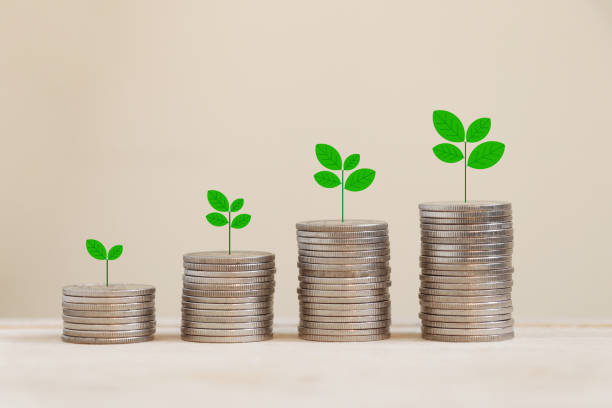 istock Silver coins arranged in a graph with there are trees on top. 1251323263