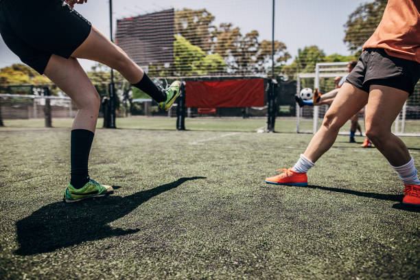 istock Men playing soccer on soccer field 1251323339