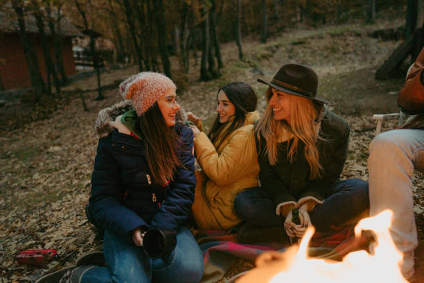 istock Girlfriends enjoying by the campfire 1251323858