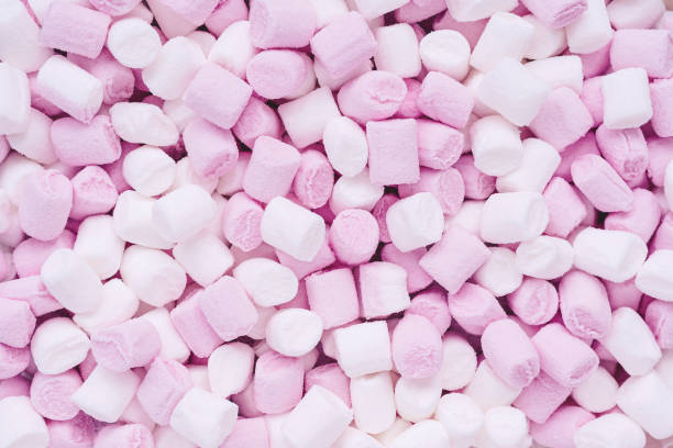 istock small white and pink marshmallows in the shape of cylinders for drinks and desserts decor - food background 1251324904