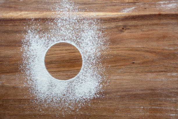 istock Circle stencil in flour on a wooden board 1251325835