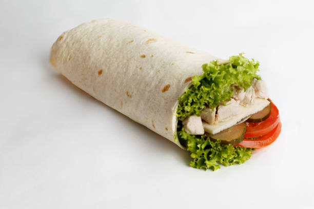istock Hot roll with chicken, lettuce, cucumber and tomatoes. Close-up 1251326097