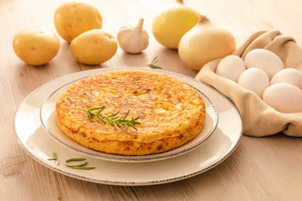 Photo of Spanish omelette with potatoes, Spanish cuisine. Tortilla espanola