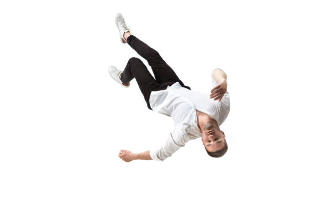 Mid-air beauty. Full length studio shot of attractive young man hovering in air and keeping eyes closed Mid-air beauty cought in moment. Full length shot of young man hovering in air and keeping eyes closed. Levitating in free falling, lack of gravity, flying. Freedom, emotions, artwork concept. hovering stock pictures, royalty-free photos & images