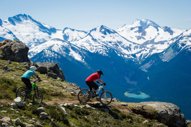 istock Couple mountain biking together on vacation 1251330745