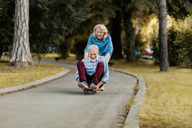 istock Senior Couple Skateboarding 1251331453