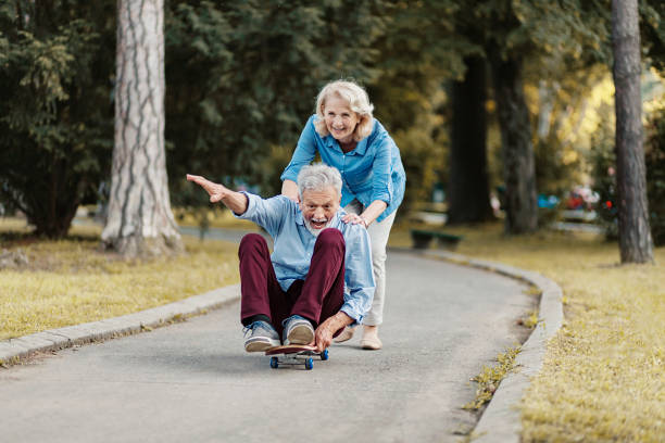 istock Senior Couple Skateboarding 1251331473