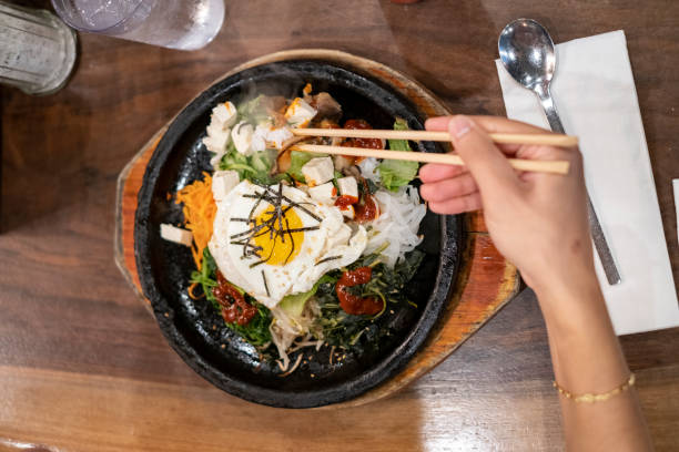 Person eating Korean bibimbap