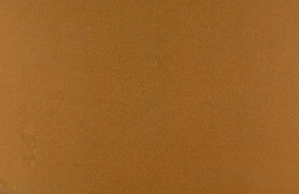 istock abstract brown background  paper with bright center spotlight and black vignette border frame with vintage 1251335207